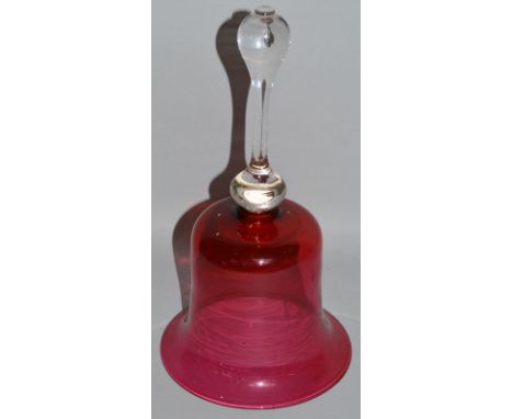 A VICTORIAN RUBY GLASS BELL with plain handle. 10.5ins high.