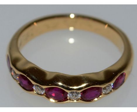 A GOOD RUBY AND DIAMOND HALF HOOP RING set in 18ct yellow gold.