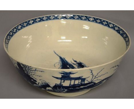 A LARGE WORCESTER BLUE AND WHITE CIRCULAR BOWL “THE PRECIPICE” CIRCA. 1765-1775. Open crescent mark in blue. 9.25ins diameter