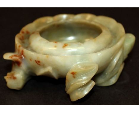 A 19TH CENTURY CHINESE JADE WATER POT, carved in the form of a lotus flower, the celadon green stone with brown inclusions, 4