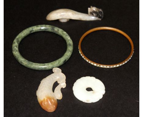 A CHINESE JADE BELT HOOK, 3.25in long; together with two small jade-like carvings 2.6in long & 1.6in diameter; and two bangle