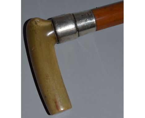 A HORN HANDLED STICK with silver band dated 1897. Initials J. S. 36ins long.