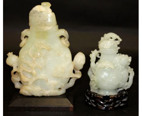 TWO CHINESE JADE-LIKE VASES & COVERS, each with a fitted hardwood stand, the vases themselves 4.9in high & 7.4in high overall