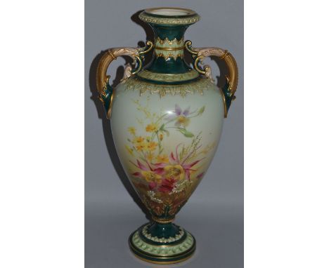 A GRAINGERS WORCESTER LARGE TWO HANDLED VASE painted with flowers on a light green ground and darker green highlights.