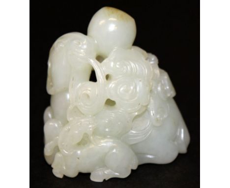 A GOOD QUALITY CHINESE WHITE JADE CARVING OF A GOAT AND ITS YOUNG, the goat bearing in its mouth a frond of lingzhi fungus, 2