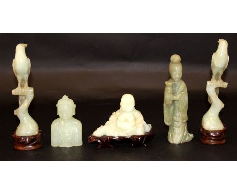 A PAIR OF CHINESE CARVED BOWENITE MODELS OF BIRDS STANDING ON ROCKWORK, each with a fitted wood stand, 8in high overall; toge