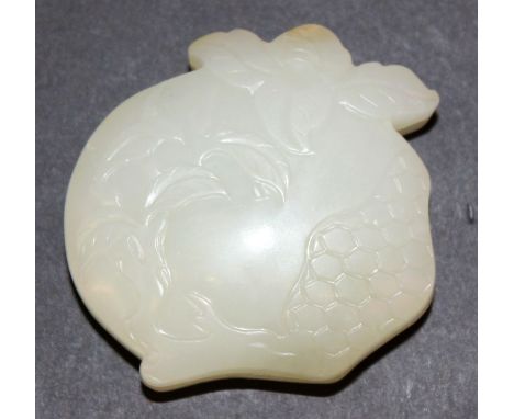 A CHINESE CARVED PEACH-FORM JADE BOX, its exterior carved in low relief with leafage, 2.3in wide.