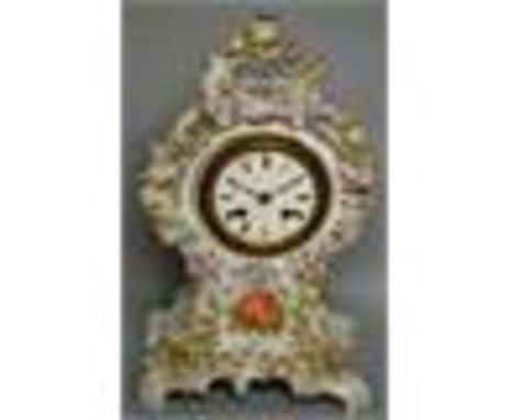 A VERY GOOD 19TH CENTURY GERMAN PORCELAIN MANTLE CLOCK encrusted with flowers and painted cupids. 14ins high.