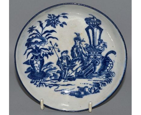 A WORCESTER BLUE AND WHITE TEA BOWL AND SAUCER “THE MOTHER AND CHILD”, CIRCA. 1775-1785.