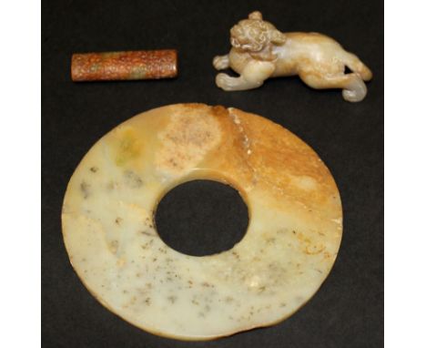 A CHINESE JADE BI DISC, of archaic design, 5.1in diameter; together with an archaic design jade-like bead, 2.1in long; & a ja