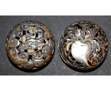 TWO UNUSUAL JAPANESE MEIJI PERIOD KAGAMIBUTA IRON NETSUKE, each pierced netsuke in two parts and with silvered and gilded dec