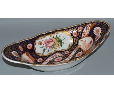 A GOOD SHAPED SHALLOW OVAL DISH, Possibly CHAMBERLAINS WORCESTER, rich blue and gilt ground painted with panels of flowers. 9
