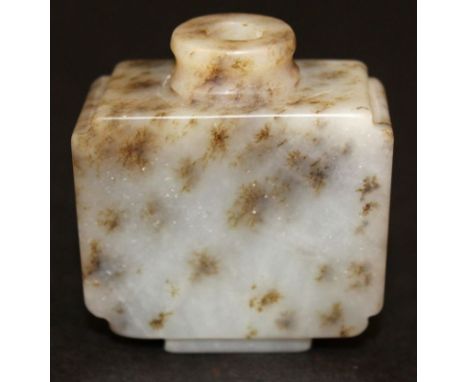 A CHINESE JADE SNUFF BOTTLE, of rectangular-section, the predominantly white stone with brown and grey inclusions, 2in high &