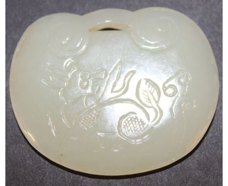 A CHINESE CELADON-GREEN JADE RUYI FORM CARVING, decorated to one side with a kirin, and to the reverse side with characters, 