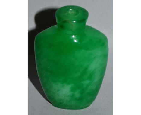 A JADE-LIKE GLASS SNUFF BOTTLE, of mottled and striated apple-green tone, 2.3in high.