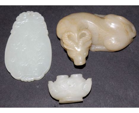 A CHINESE WHITE JADE PENDANT, carved to one side in low relief with a boy and lotus, 2.7in high; together with a small jade-l