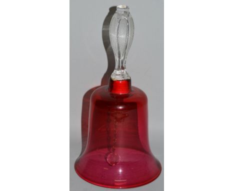 A VICTORIAN RUBY GLASS BELL with plain etched handle. 9.5ins high.