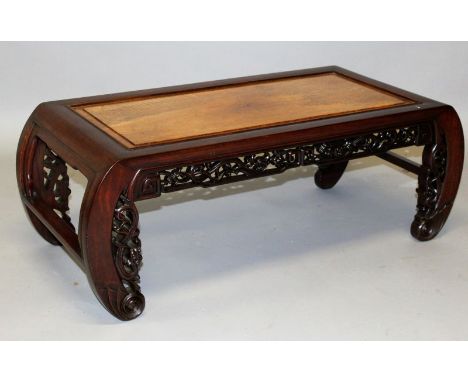  A GOOD 19TH CENTURY CHINESE REDWOOD OPIUM TABLE, with inset burr top, curving ends with pierced frieze and legs ending in ba