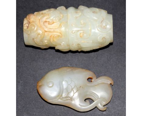 A GOOD QUALITY CARVED JADE BEAD, of archaic design and larger than average size, 2.5in long; together with a jade model of a 
