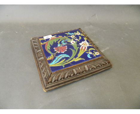 A Victorian carved walnut musical stand with inset ceramic tile with Isnik design, 11" x 11" (tile AF)