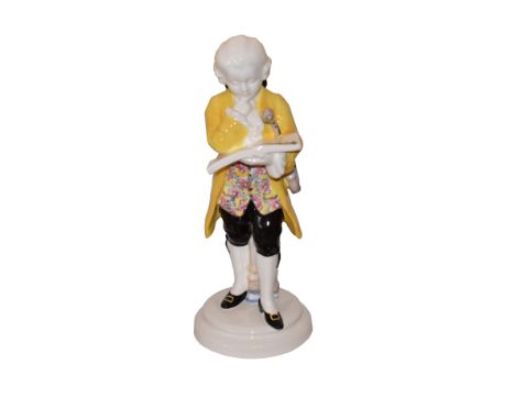 Design: circa1913 by Perigot, manufactured by Goldscheider, Vienna, ceramics young mozart figurine. polychrome standing on st