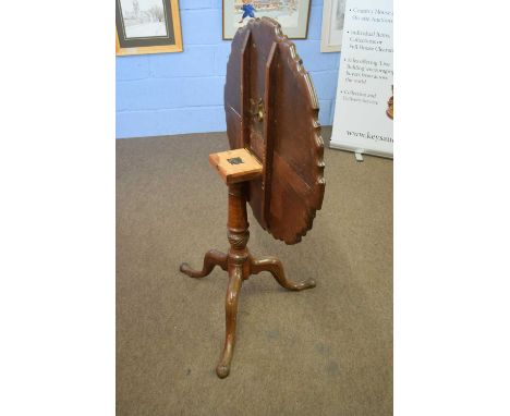 19th century and later mahogany snap-top supper table, the top with shaped edge over a turned column and tripod base, top 73c
