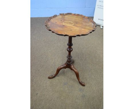 Small mahogany wine table with shaped top over a turned column and tripod base, 73cm high (a/f)