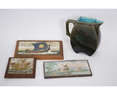 Wedgwood 19th century Majolica style jug and three tiles with tube lined designs of Viking ship and Dutch landscape scene, la