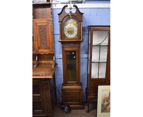 20th century Tempus Fugit longcase clock, the oak case with broken arch pediment and glazed trunk door and box base, the dial