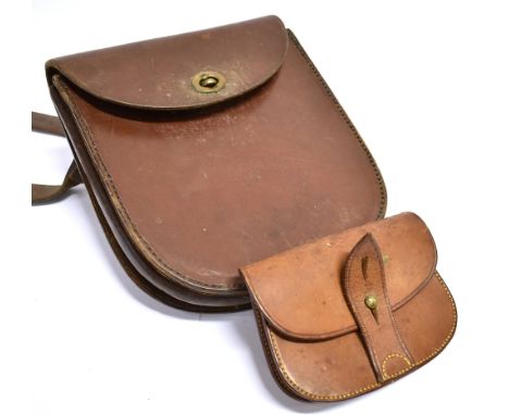 A SATCHEL SHAPED EXPANDING LEATHER PURSE for cap money, 14cm wide x 10cm deep with belt/strap fitting and a compartmented lea