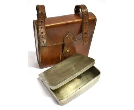 A RECTANGULAR SANDWICH TIN by Army and Navy Cooperative Stores Ltd., contained in a compartmented leather case for saddle mou