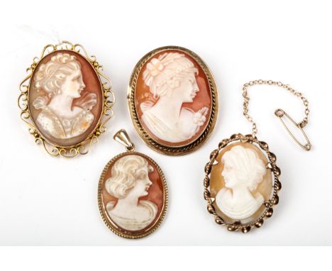 Three vintage gold and oval shell cameo brooches and a pendant. Each depicting and unknown female bust. One brooch with an op