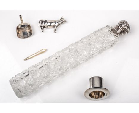 A collection of small silver items. Comprising; a late Victorian silver mounted cut clear-glass long scent bottle, the floral