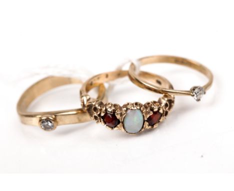 Two vintage 9ct gold and small diamond solitaire rings and a garnet and opal three stone ring in Victorian style. This size M