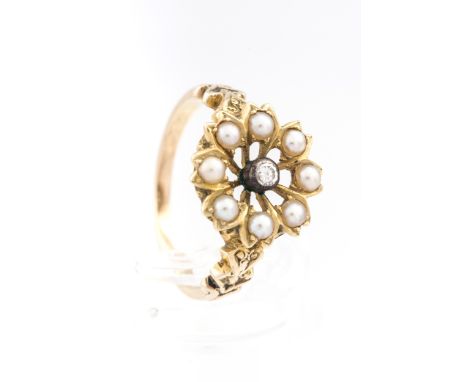 A Victorian gold, half-pearl and diamond open flower-head cluster later adapted as a ring. Set at the centre with a small old