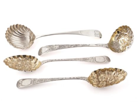 Two George III silver ladles and a pair of William IV Scottish 'berry' spoons. Comprising; a sugar sifter ladle with a pierce