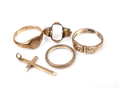 Three 9ct gold rings, a Latin cross pendant and a partial ring mount. Comprising; A vintage buckle ring, mark of Brown and Ne