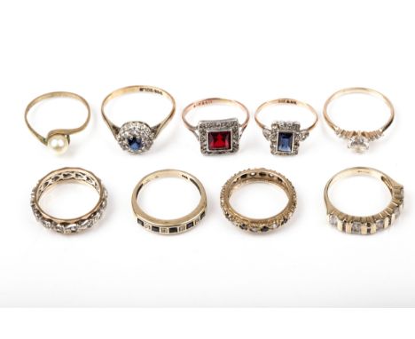 A group of nine vintage gold and gem set rings. Including two 9ct gold and paste eternity rings; a round and emerald-cut CZ h