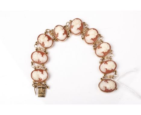 A vintage Italian gold and oval shell cameo panel bracelet. Each depicting an unknown female bust facing right, rub-over set 