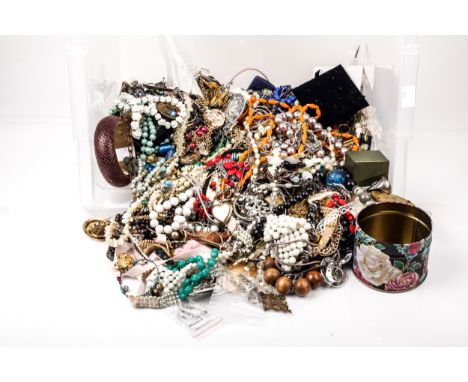 A large collection of mostly vintage costume jewellery and other items. In a clear plastic tub