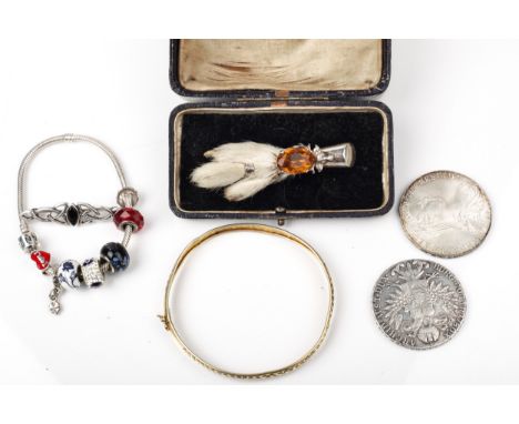 A small collection of jewellery. Including a silver-gilt hinged bangle stamped '925', a bracelet; a Scottish claw brooch; a '
