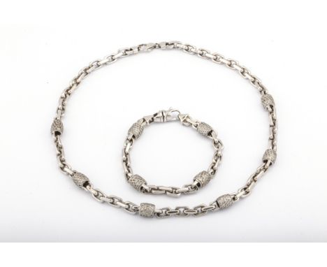 A vintage Italian diamond-set curb link bracelet and a matching necklace. Each with pave set diamond barrel-shaped beads at i