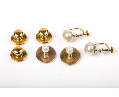 Various early 20th century gold studs. Comprising two with small cultured-pearl terminals, stamped '18', 3.3g gross, in a Col