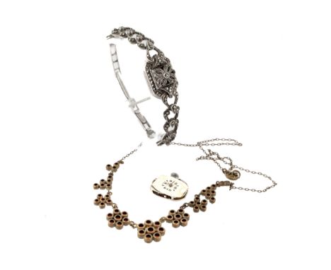 A Continental 800 standard silver and marcasite bracelet dress watch and a red-paste cluster necklace. The watch with a white