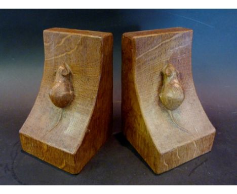 A Pair of Early 20th Century Robert (Mouseman) Thompson Oak Bookends, each decorated in relief with a mouse, 15 cms tall