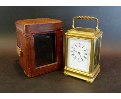 A 19th Century Brass Cased French Carriage Clock, the enamel dial with Roman and Arabic numerals and with lever escapement, t