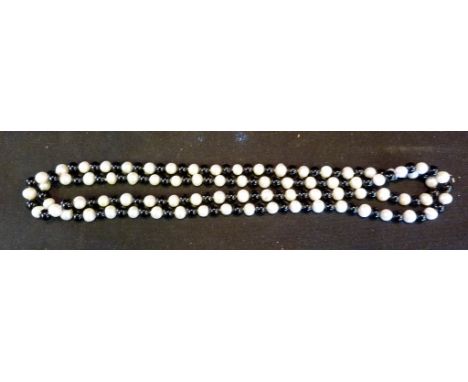 A Pearl and Black Stone Long Bead Necklace