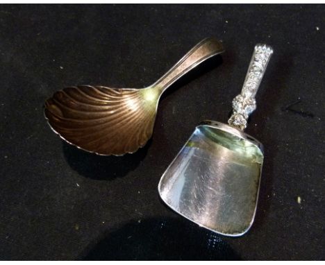 A William IV Silver Caddy Spoon with Scallop Form Bowl, together with another similar continental caddy spoon