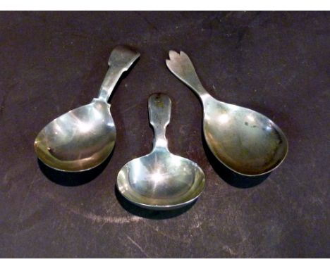 A Georgian Silver Caddy Spoon, with fiddle pattern handle together with two Victorian silver caddy spoons