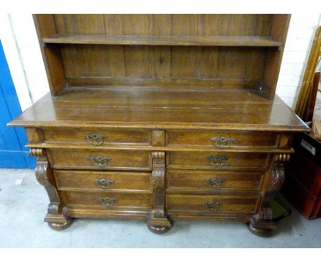 A 19th Century Continental Dresser, the boarded shelf back above eight drawers with metal handles and with carved capitals ra